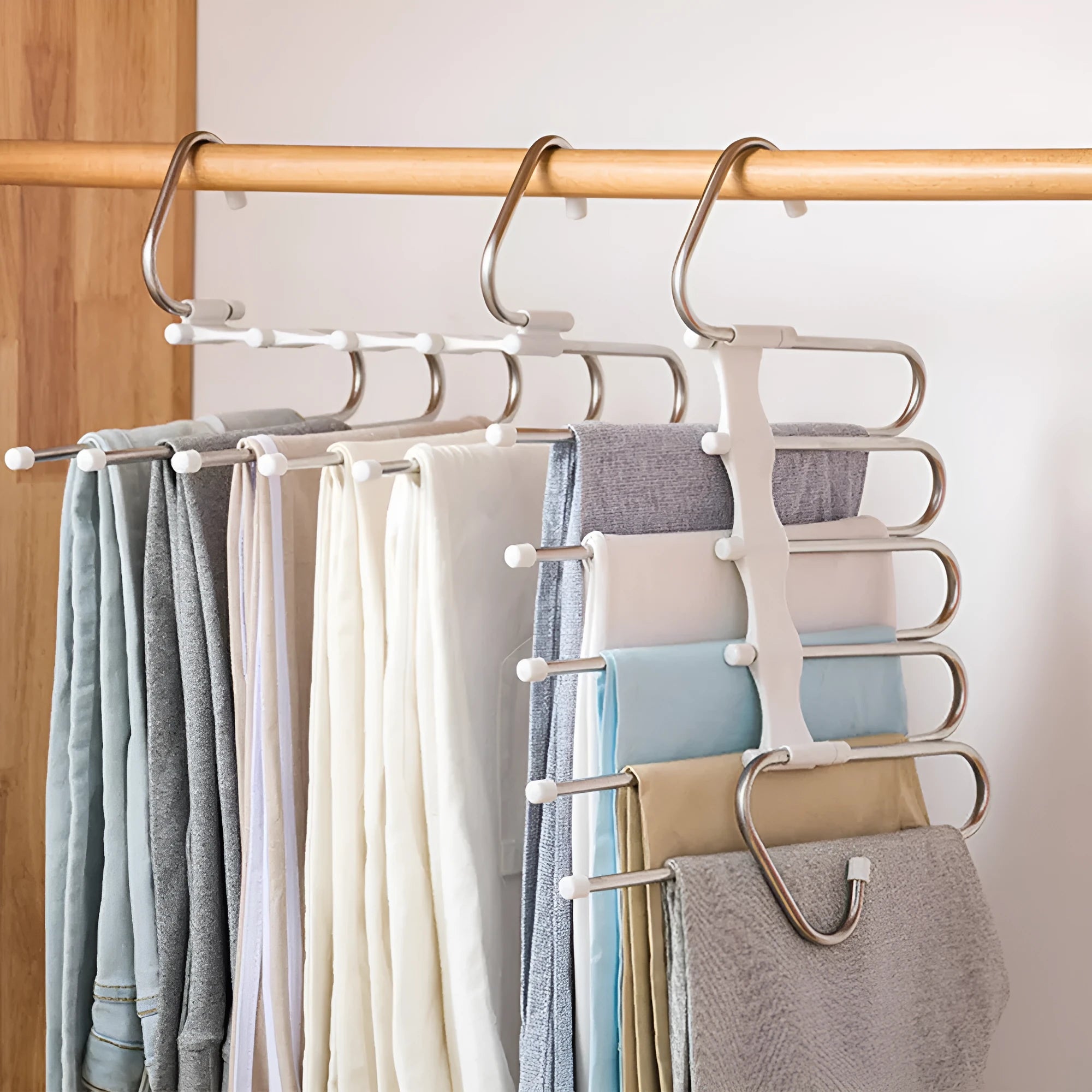 Black stainless steel wardrobe hanger with five booms for trousers organisation