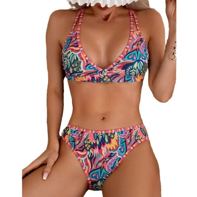 Women's printed halter neck swimsuit with mixed colour design and matching T pants.