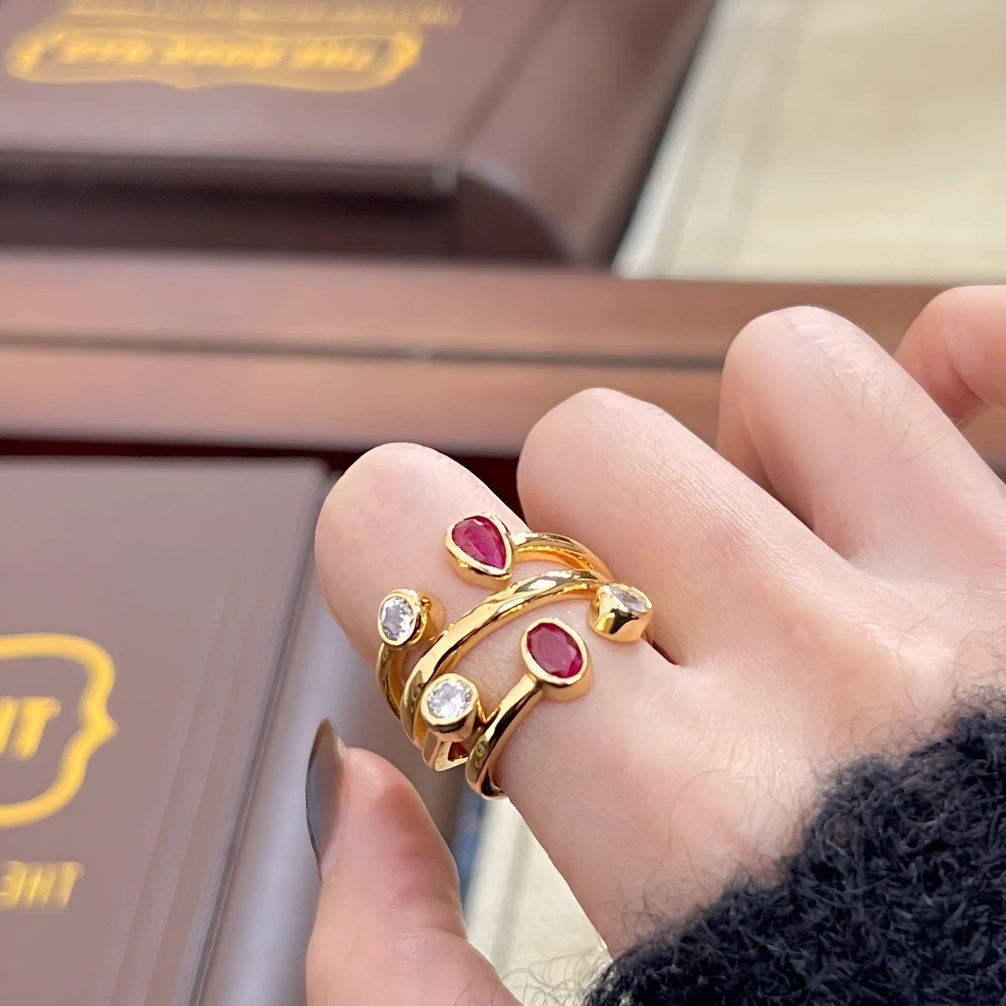 Retro two-tone geometric cross ring with a double-headed design and group diamond setting.