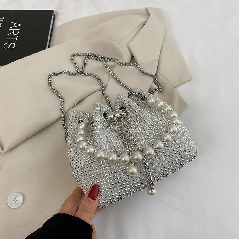 Soft PU leather crossbody bucket bag with diamond decorations and a chain shoulder strap.