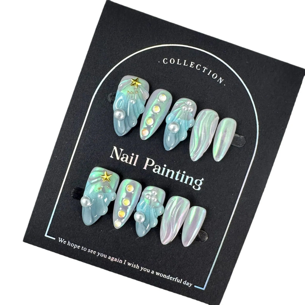 Set of blue plastic shell-shaped nail stickers in sizes XS, S, M, and L