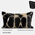 Black and gold abstract pattern flannel cushion cover on a sofa