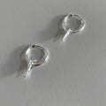 Platinum coloured geometric star shaped ear clips for women with a white gold plated finish
