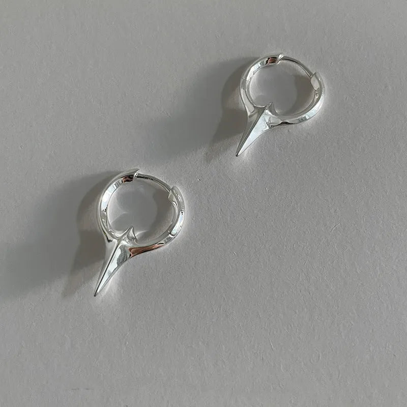 Platinum coloured geometric star shaped ear clips for women with a white gold plated finish
