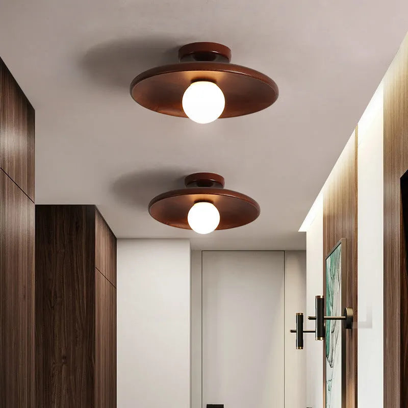 Solid wood modern minimalist ceiling lamp with glass shade in three sizes.