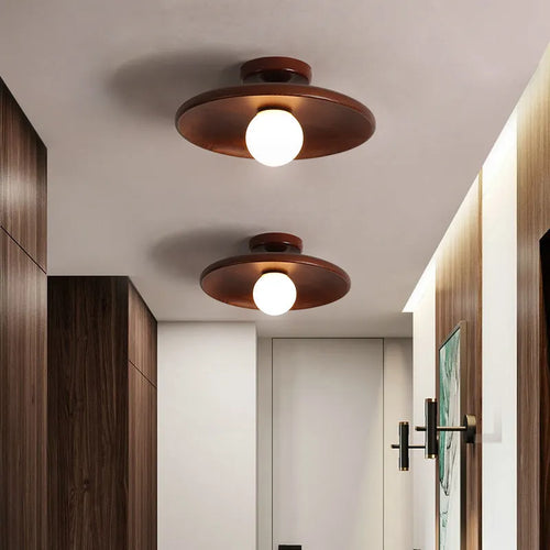 Solid wood modern minimalist ceiling lamp with glass shade in three sizes.