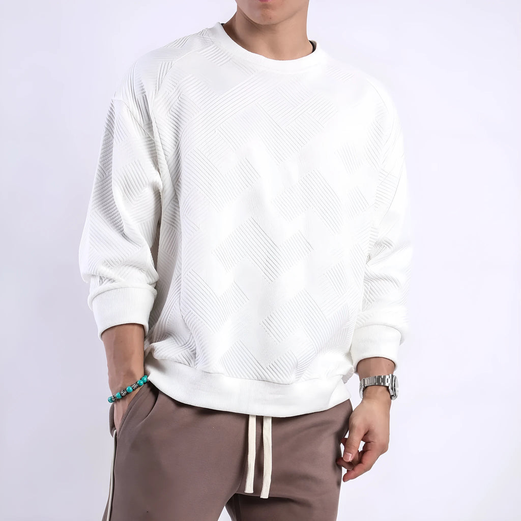 Men's loose fit solid colour twill jacquard pullover sweater on a hanger.