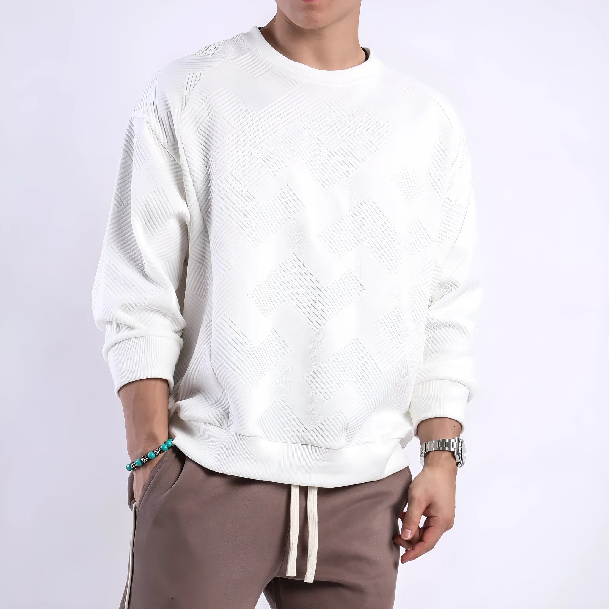 Men's loose fit solid colour twill jacquard pullover sweater on a hanger.