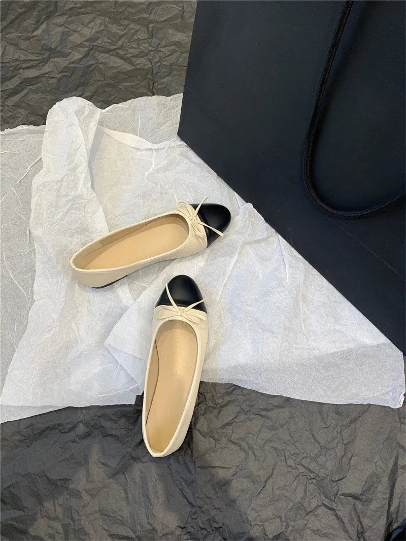 Women's ballet flat shoes with round toe and bowknot detail in soft rubber sole construction