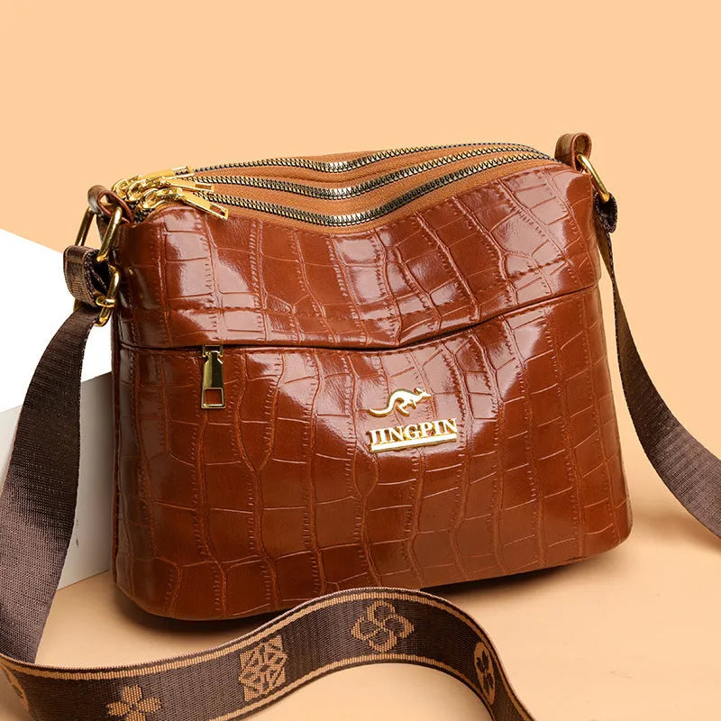 Large capacity multi compartment cross body bag in brown PU with sandwich pocket and sewing thread detail