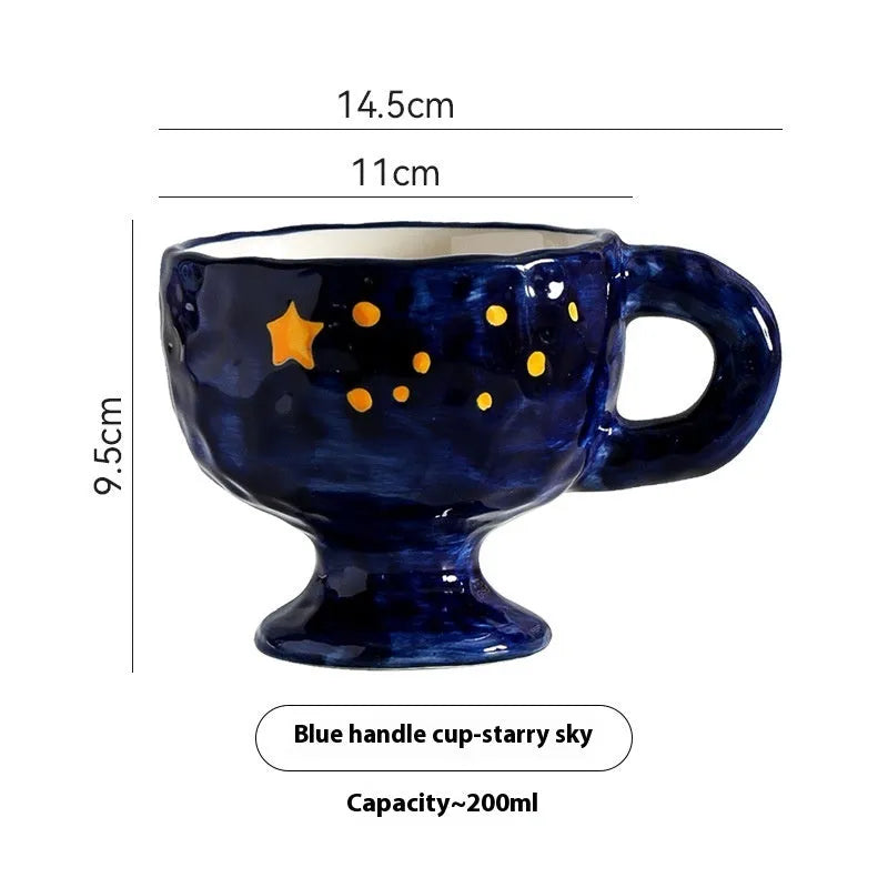 Handmade irregular solid colour ceramic mug on a table, showing its unique shape.