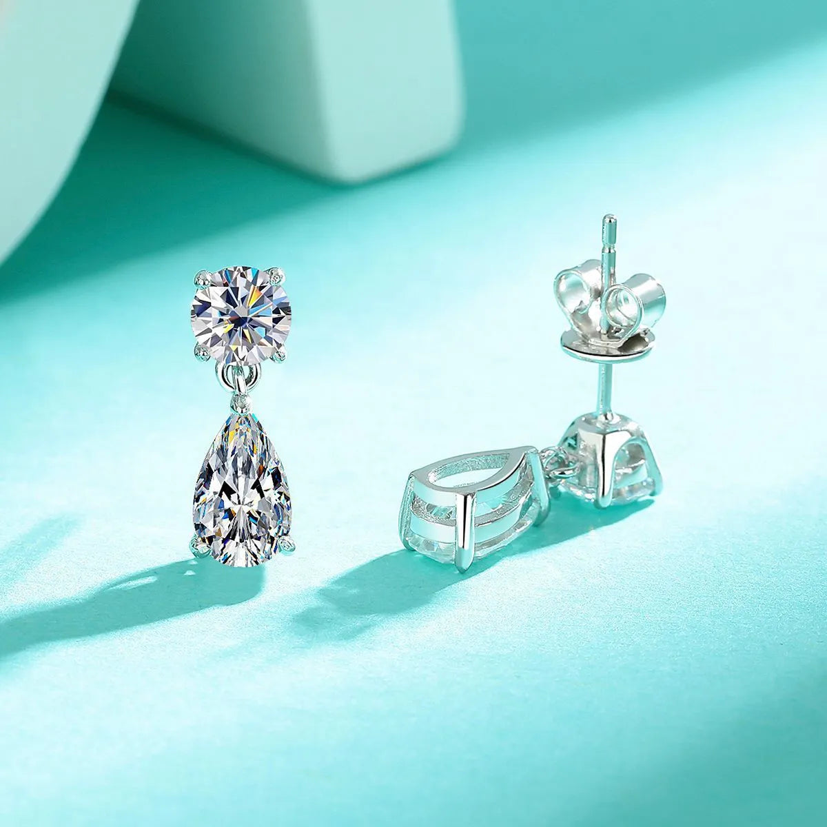 Two pairs of moissanite stud earrings: round stones and water drop shapes in gold or silver plating