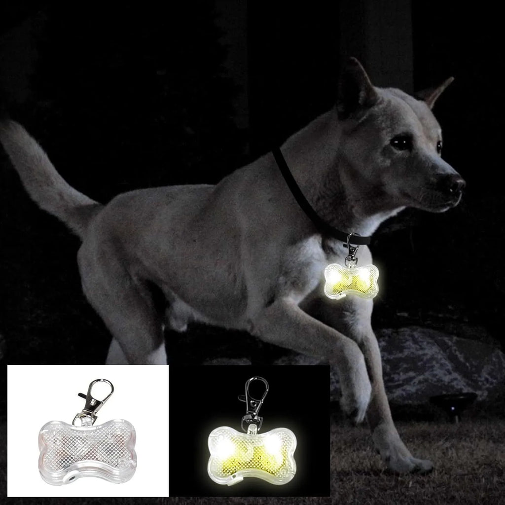 Blue LED luminous bone-shaped pendant for pet collars showing scale next to LR44 batteries.