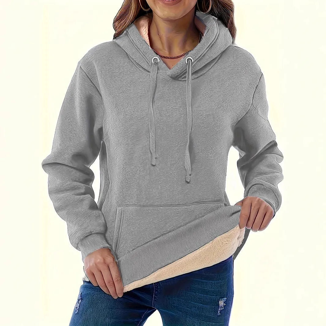 Women's loose hooded sweater with pockets in black colour showing 3D pattern detail