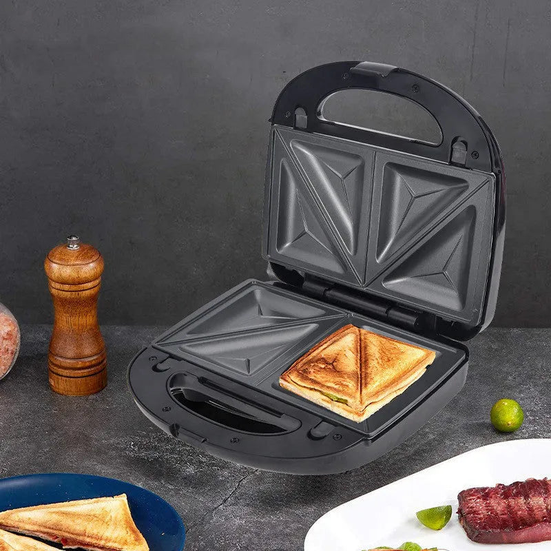 Black double-sided heating electric sandwich pan with brushed stainless steel lid and non-stick plates