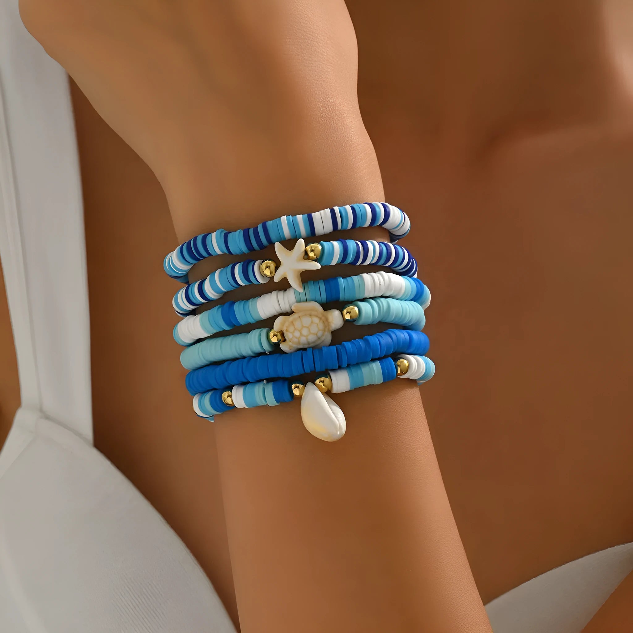 Set of six handmade bohemian polymer clay bracelets with shell and geometric designs in S3162 colour.