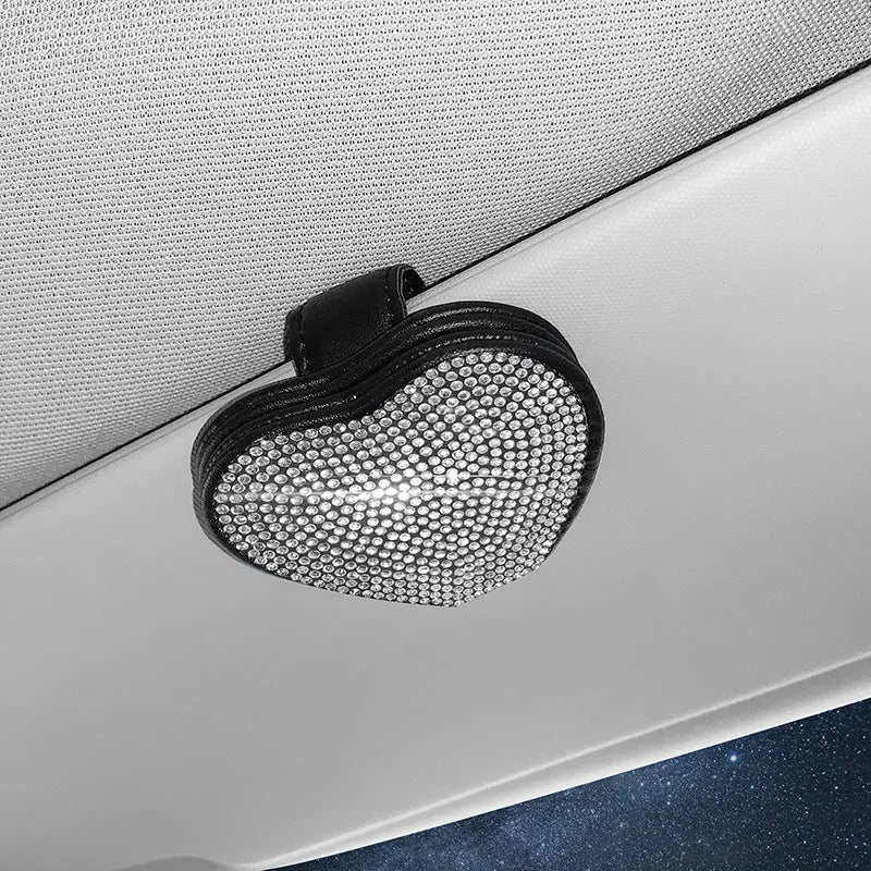 Black PU leather magnetic storage clip with diamond encrustment, shown attached to a car sun visor.