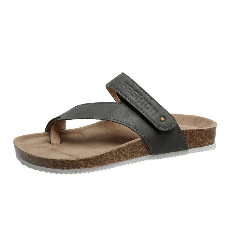 Blue thick-soled flat toe ring flip-flops on a white background.