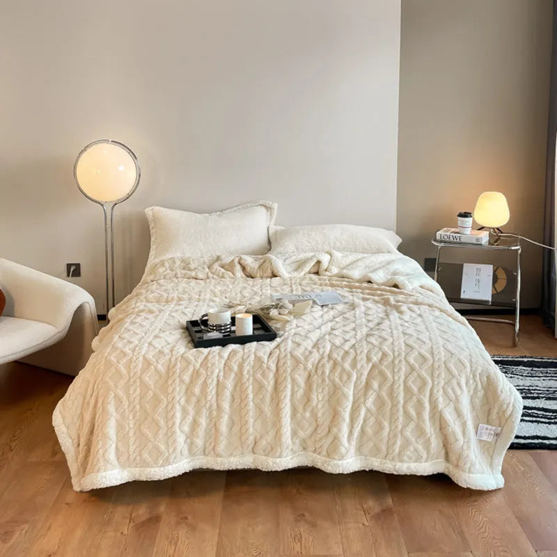 Polyester winter thermal flannel blanket in beige, laid flat showing its texture and simple modern style.