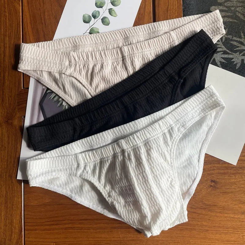 Men's pure cotton triangle briefs in a solid colour on a mid waist.