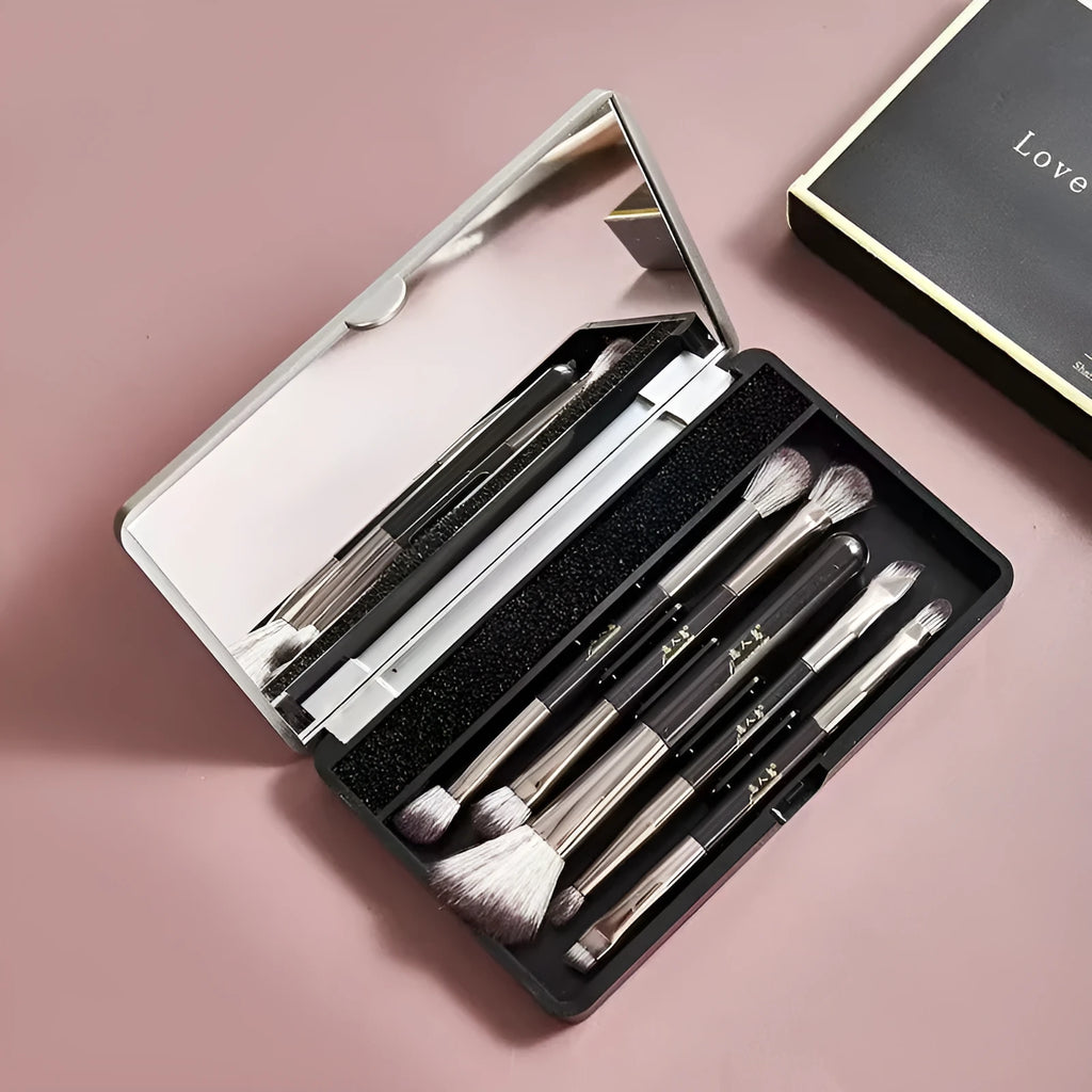 Silver and gold makeup brush sets in a case with a mirror, showing artificial fibre bristles.