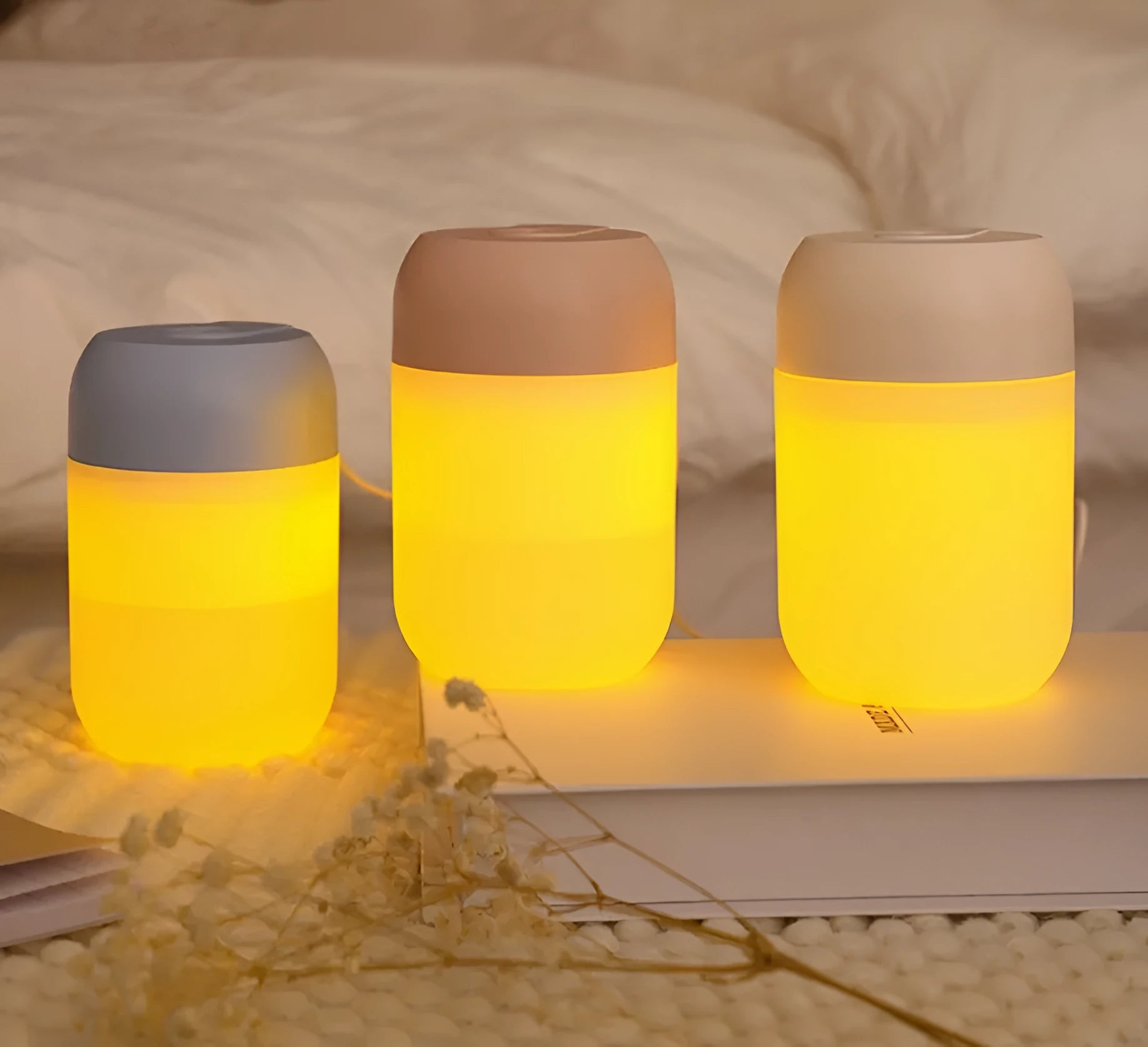 Small white cylindrical USB-powered humidifier with charging cable.