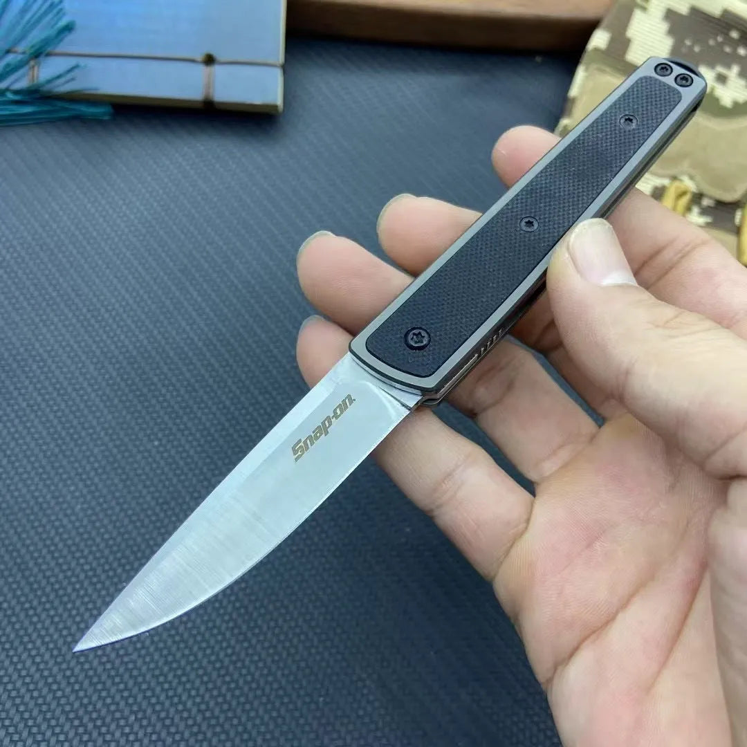 Folding fruit knife with stainless steel blade in black, brown, or red colour options showing 17cm length