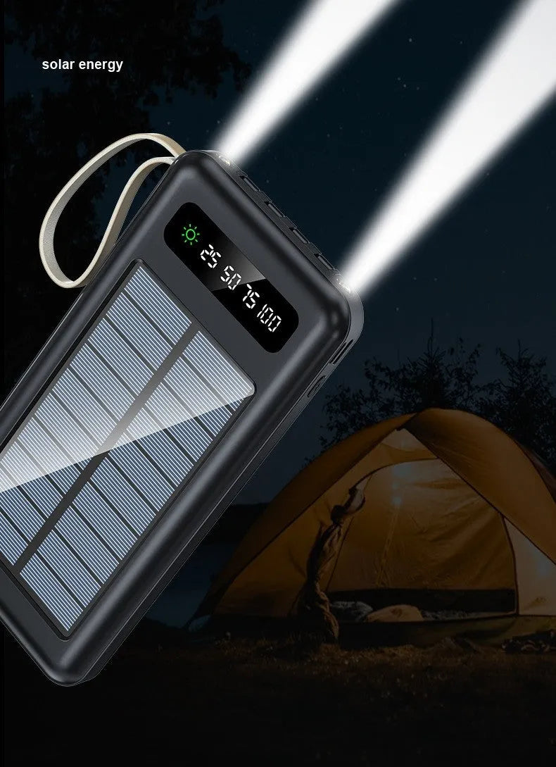 Cool black and ivory white solar power bank with capacity display and charging cable.