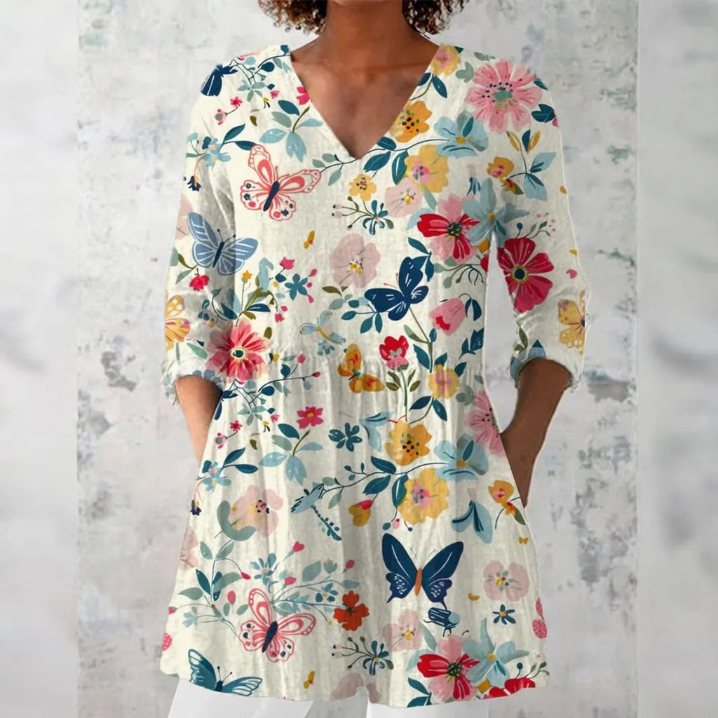 Women's retro-style slim fit long-sleeved top with a colourful digital print pattern.
