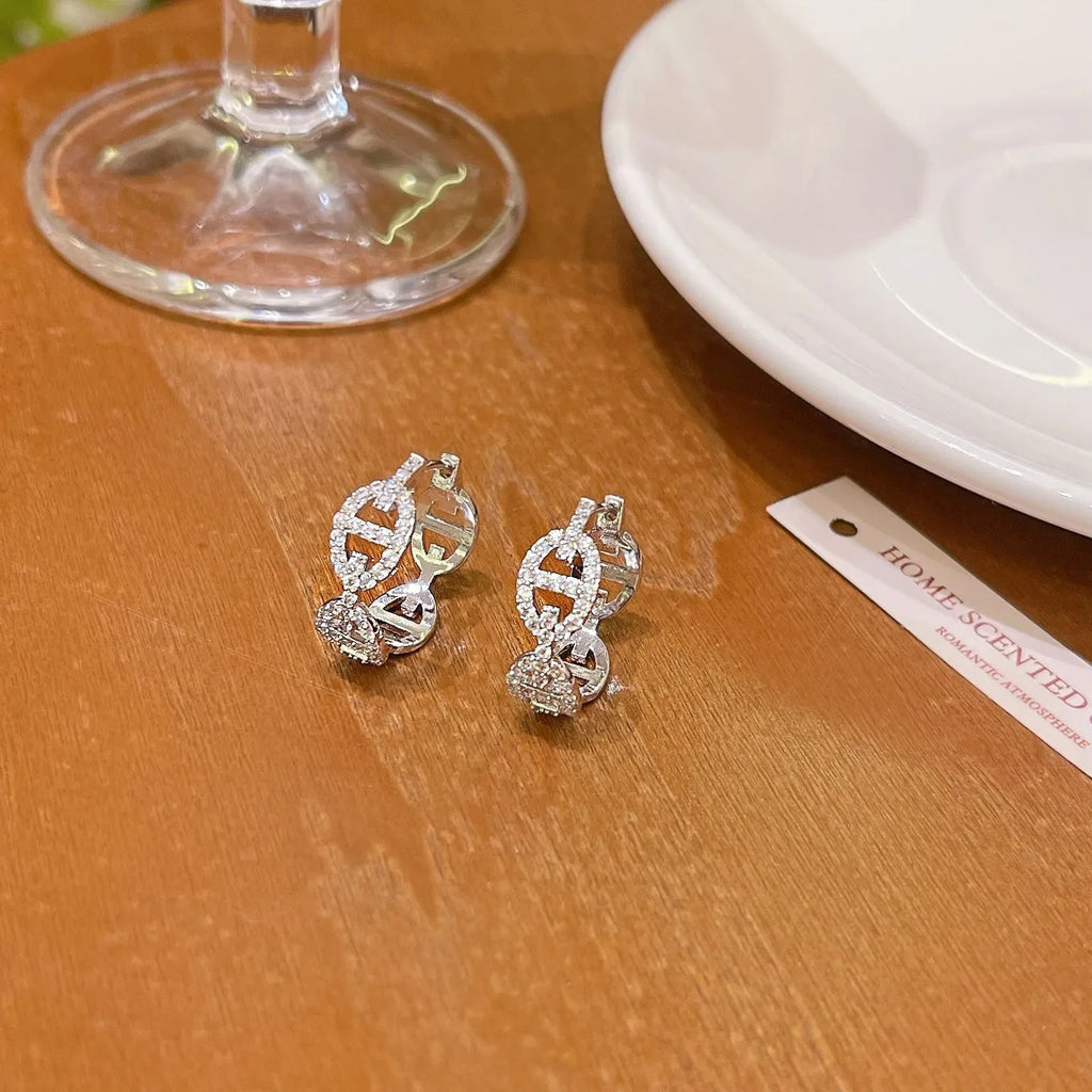 Ladies casual drop earrings with diamond design in silver, gold, or rose gold electroplated finish.