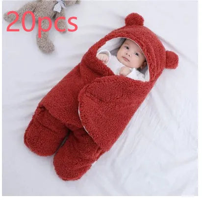Baby quilted sleeping bag wrapper in cotton blend fabric, shown in a light blue colour.