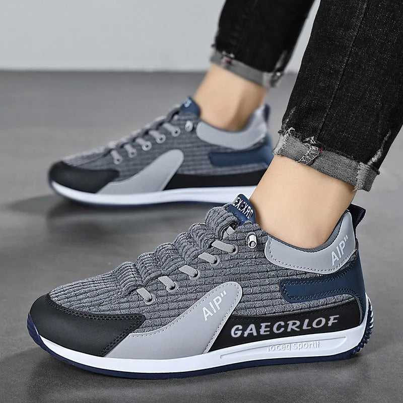 Men's green and grey low-top mesh running shoes with lace-up front and round toe.