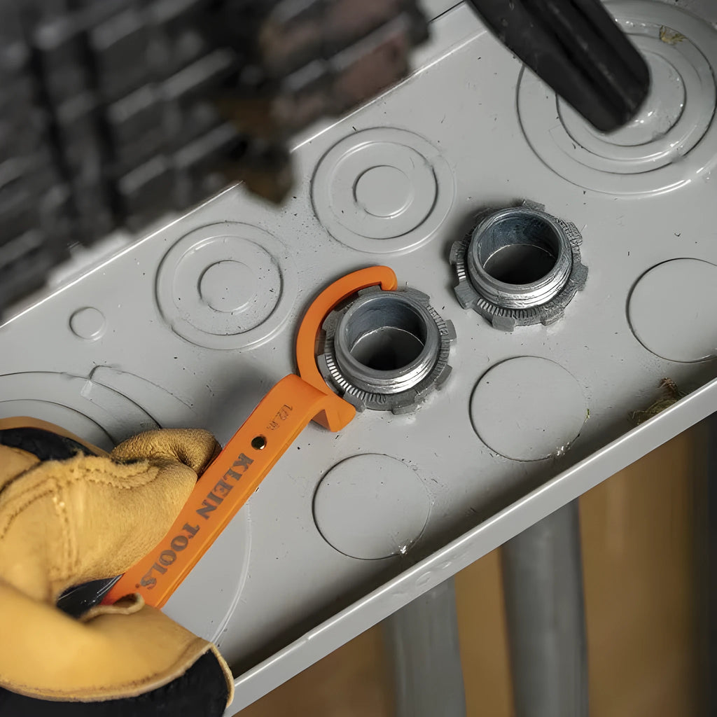 Three colour-coded magnetic suction catheter locking wrenches: orange, grey, and black, arranged as a tool set.