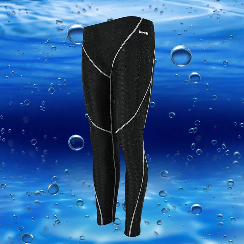 Men's black nylon cropped swimming trunks with grey line detail, brief style for sports