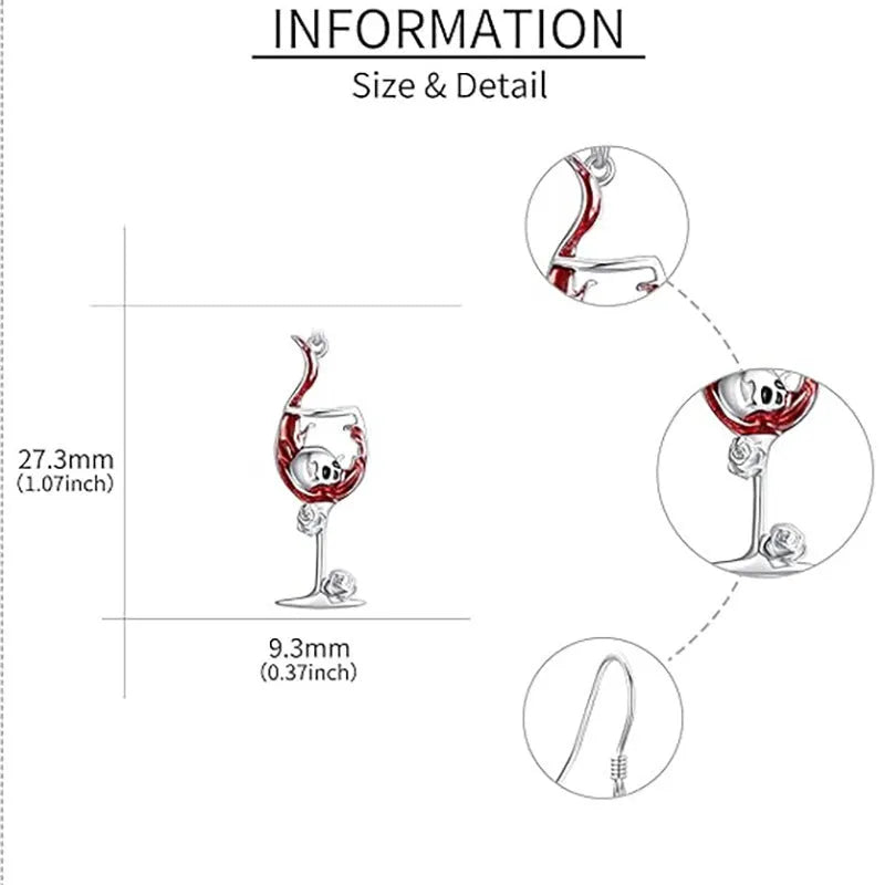 A pair of silver-toned drop earrings featuring a detailed geometry skull design combined with a wine glass shape.