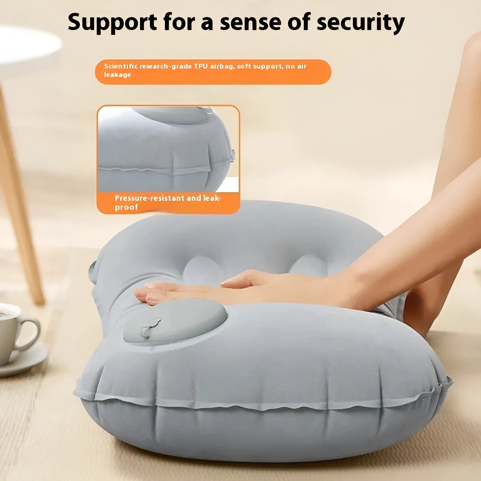 Grey press inflatable travel pillow showing size and flocking texture next to deflated state.