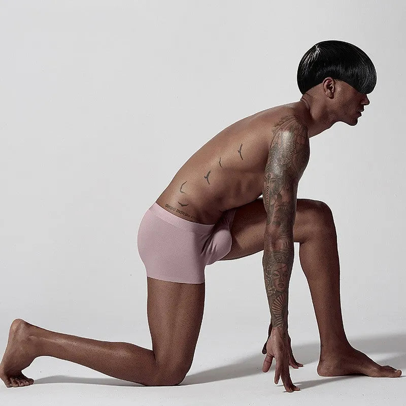 Men's seamless modal underwear in mid-waist fit, shown in green colour.