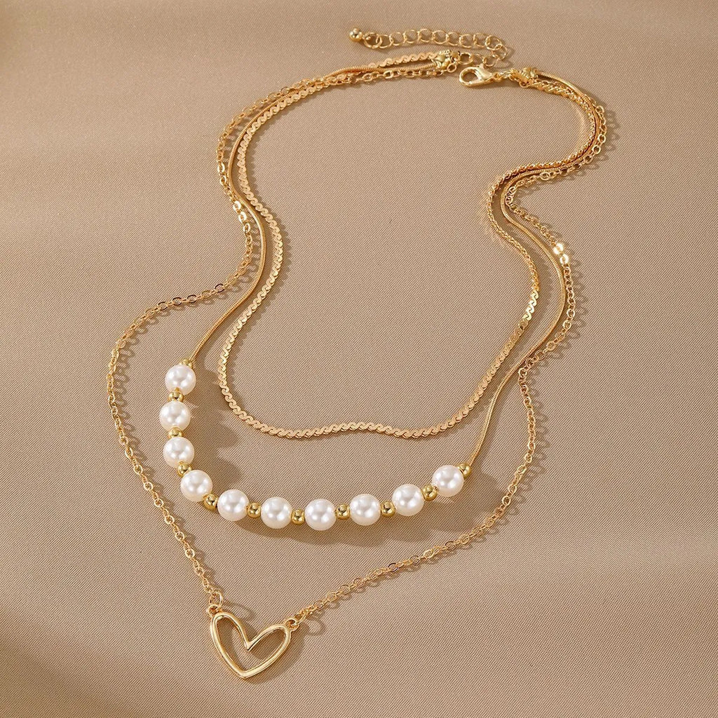 Vintage gold tone necklace with heart pendant on pearl chain, adjustable 41-50cm length