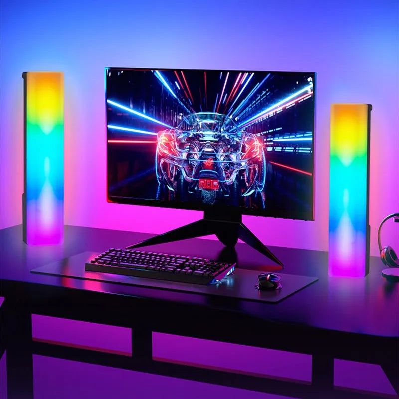 3D RGB music rhythm table lamp with voice control in black or white shell on a desk.