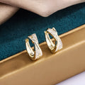 Pair of geometric earrings with 14K yellow finish on copper