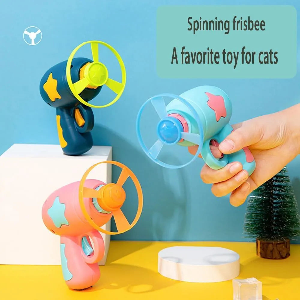 Blue plastic cat toy gun with spinning Frisbee launcher for indoor cats