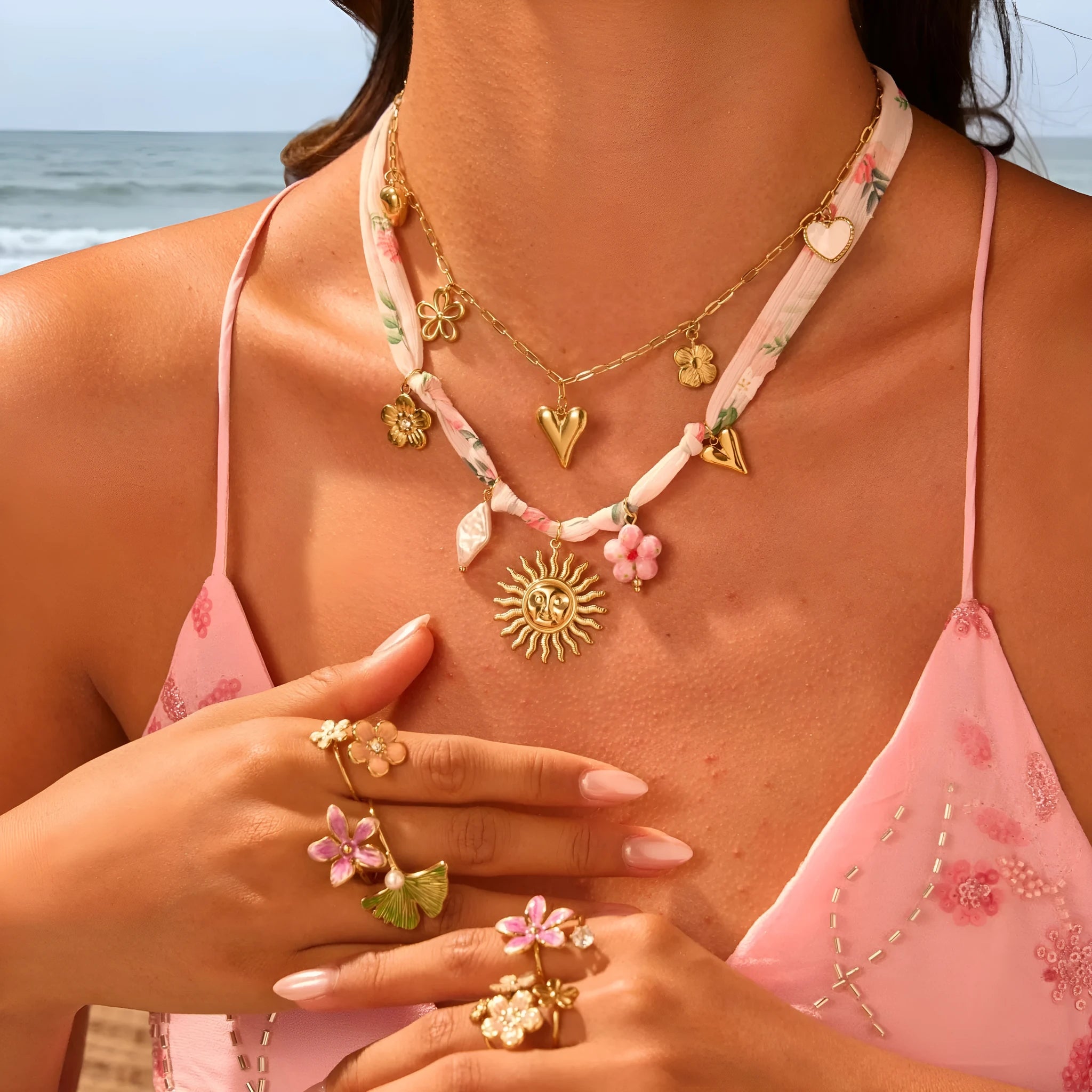 Stainless steel necklace with geometric sun pendant and 18K gold electroplated finish