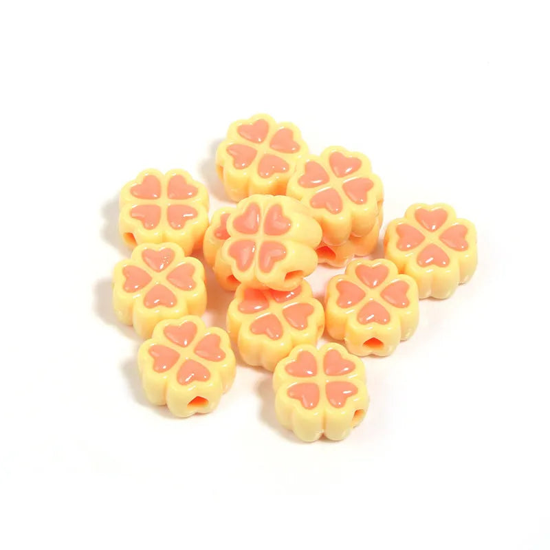15mm acrylic clover craft beads with frosted finish in multiple colours including pink, blue, yellow, and green