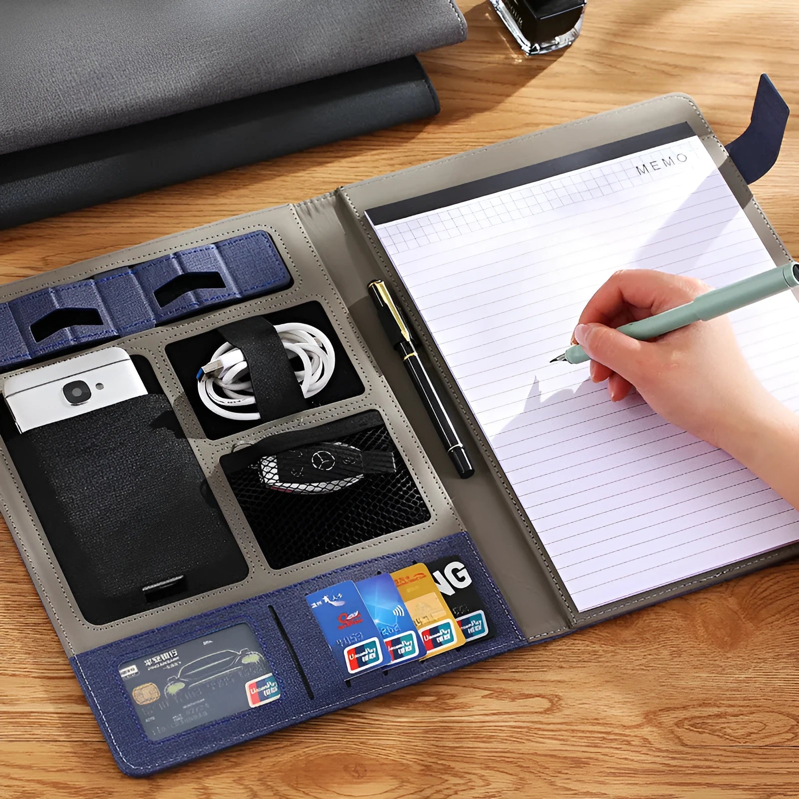 Black leather A4 business folder with optional pen and notepad, shown closed.