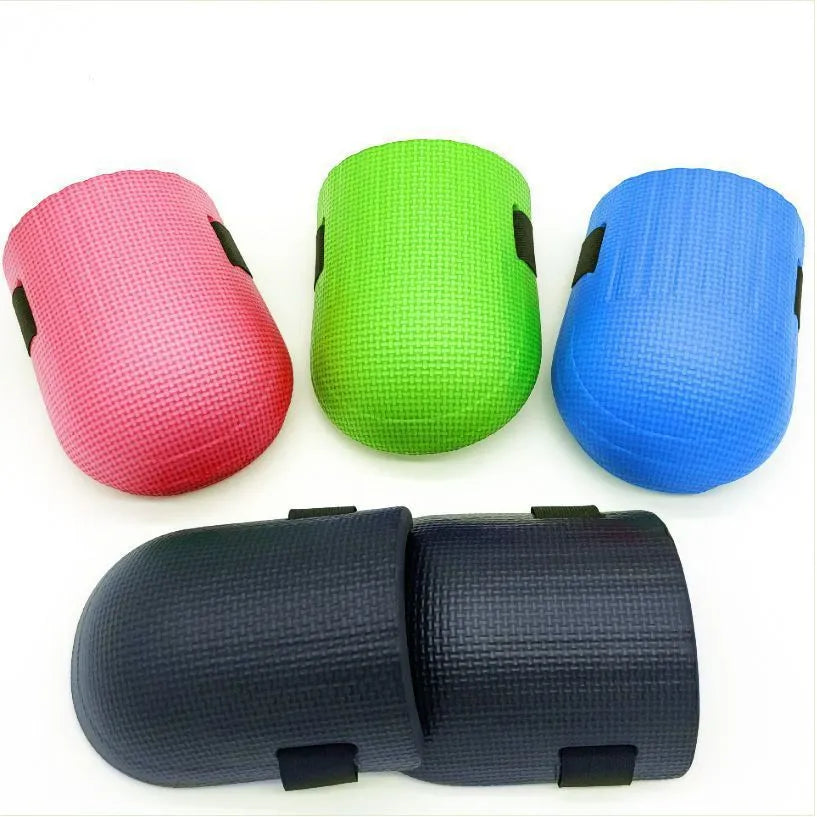 A pair of thick EVA foam kneepads in blue, designed for kneeling protection during auto repair or construction work.