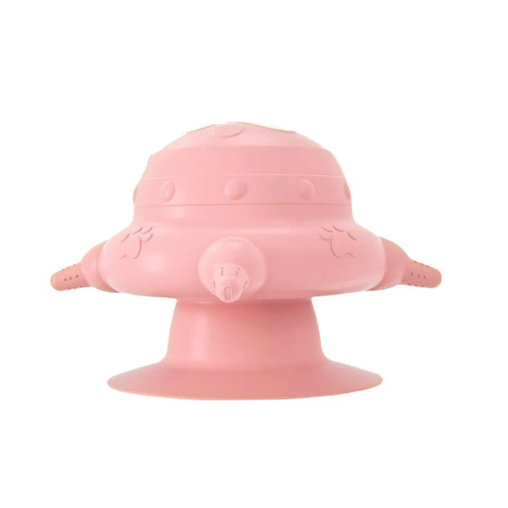Pink silicone pet nursing device with pacifiers for feeding puppies and kittens.