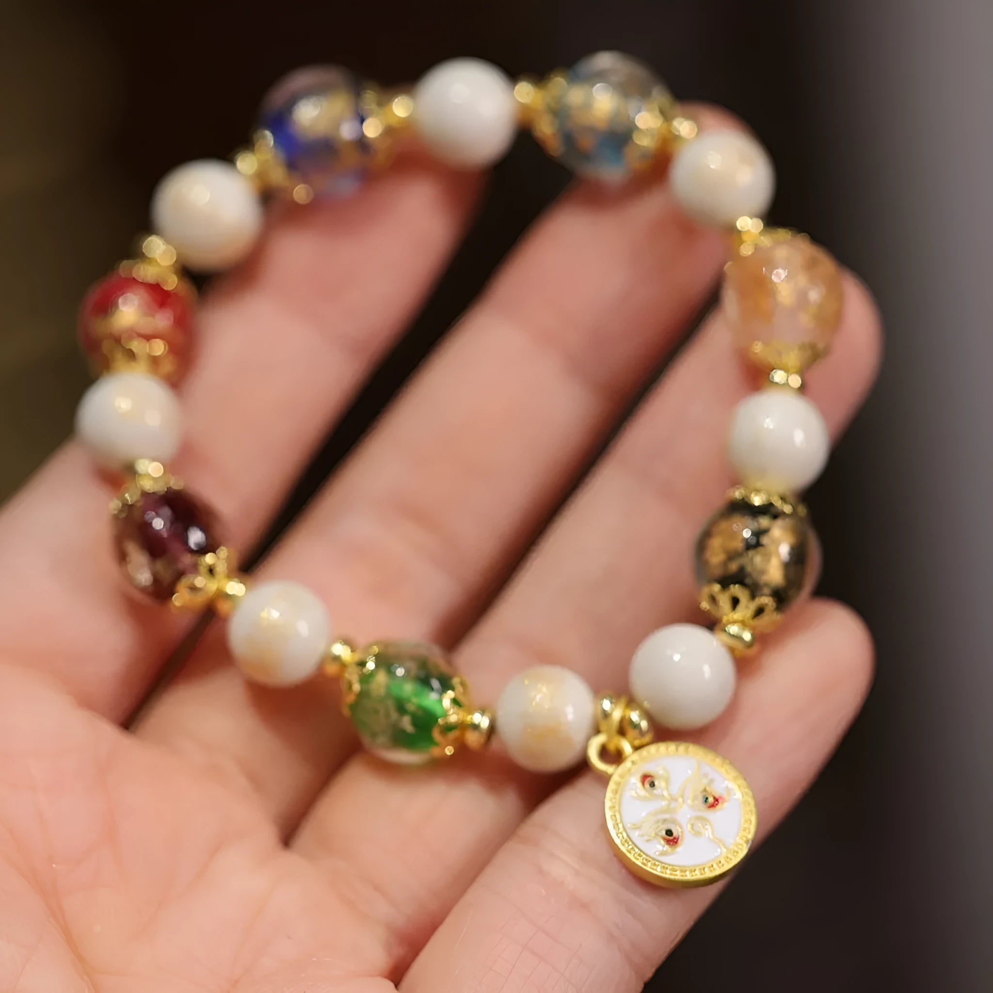 Fragrant Gray handmade glass bracelet with five Gods of Wealth design in coloured glaze.