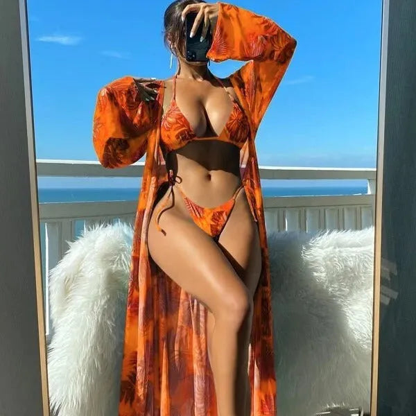 Split long sleeve ins blouse and banded bikini swim set with matching outer robe in multiple colours.