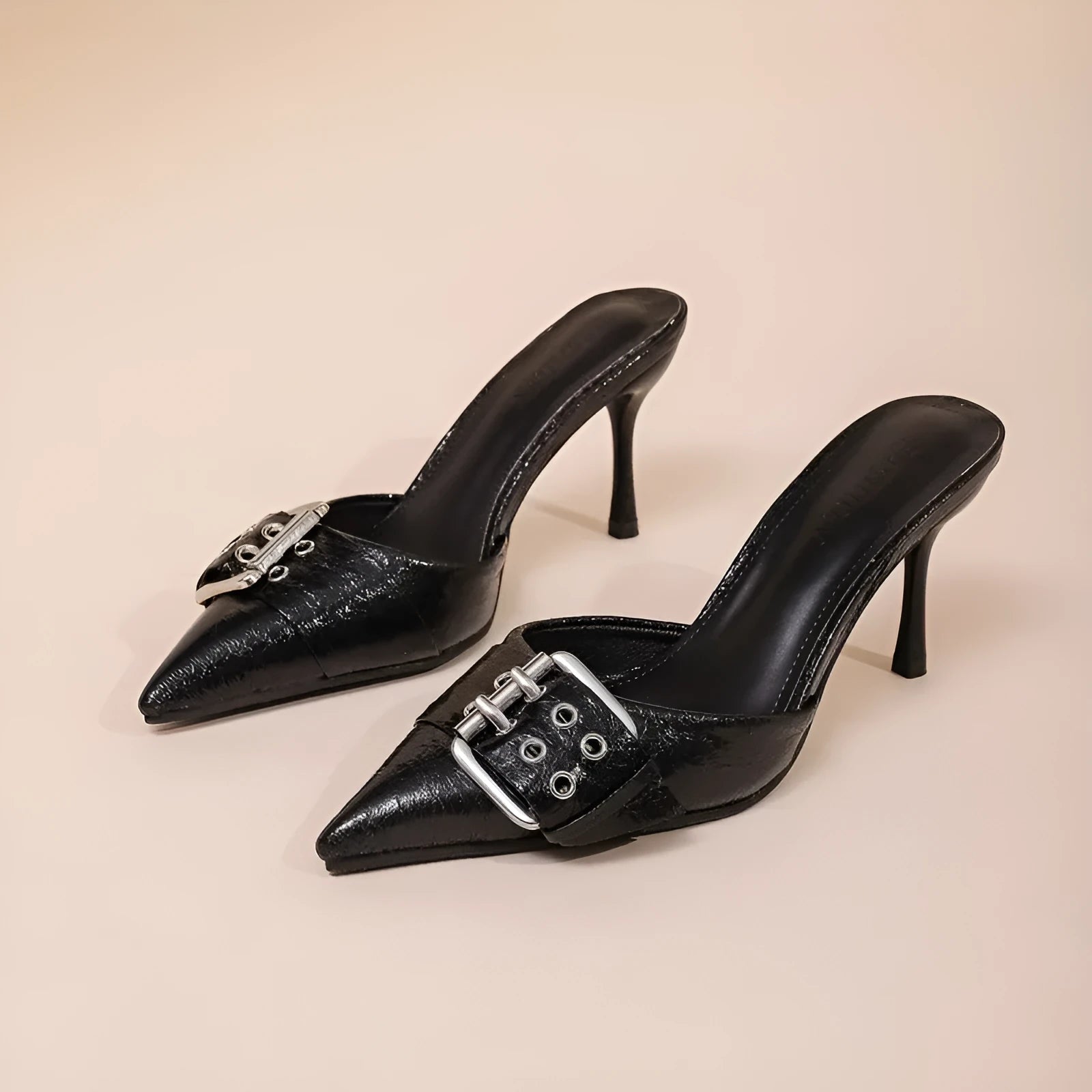 Black women's high heels with pointed toe and decorative buckle ankle strap