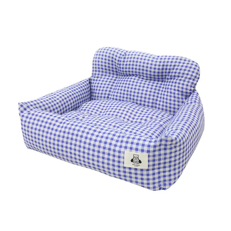 Grey and blue plaid cloth dog bed designed for car travel, shown in small and large sizes.